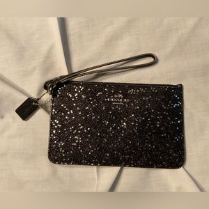 Coach black with sparkles wristlet.